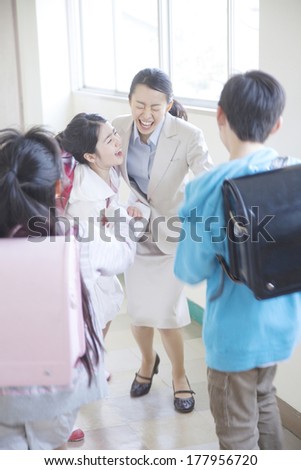 female teacher who is going to hug students