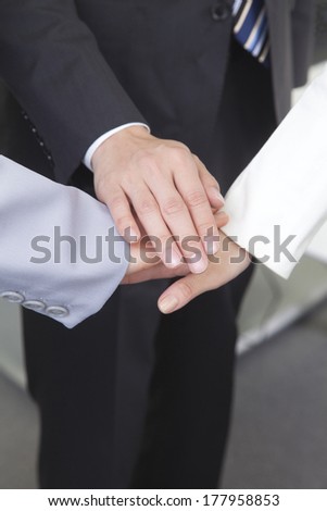 Three businessman hands together