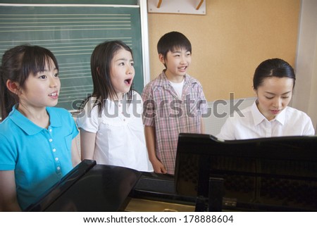 Japanese Primary student who practices the chorus in a music room