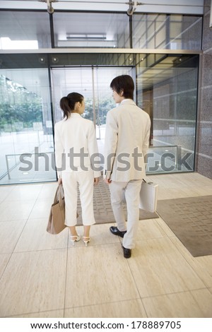 Japanese businesswoman leagues leaving the company building together