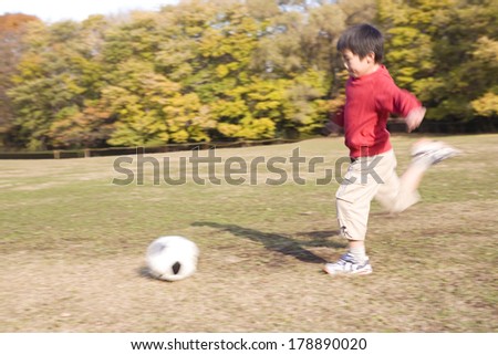 Japanese Primary student playing soccer