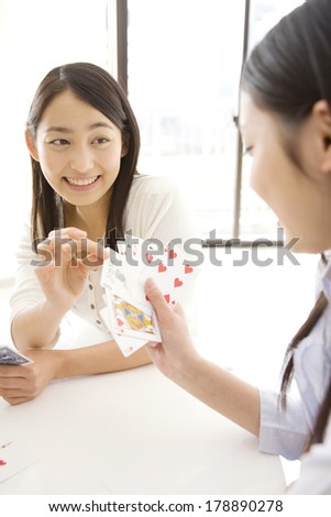Japanese woman playing Trump card