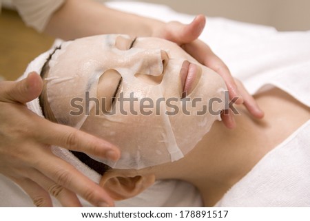 Japanese woman who is applying a face pack