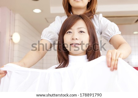 Japanese woman and hairdresser in hair salon
