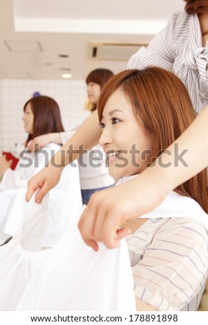 Japanese woman and hairdresser in hair salon