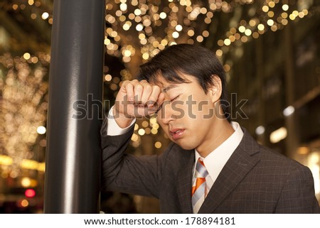 Japanese businessman looking distressed