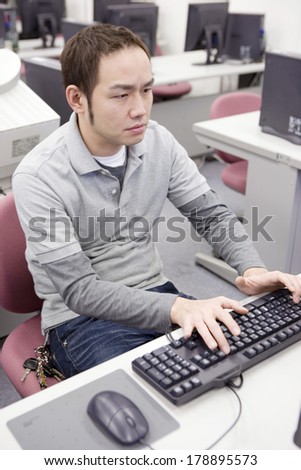 Japanese Student studying on a PC