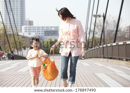 Japanese girl with the eco-bag with his mother