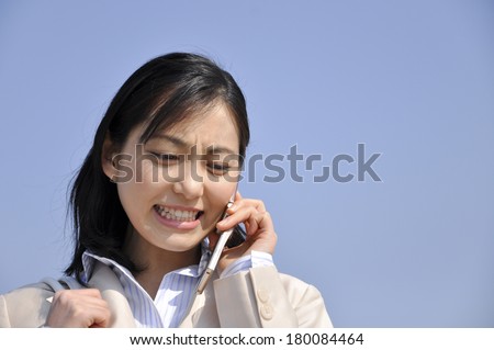 Japanese businesswoman speaking on mobile phone