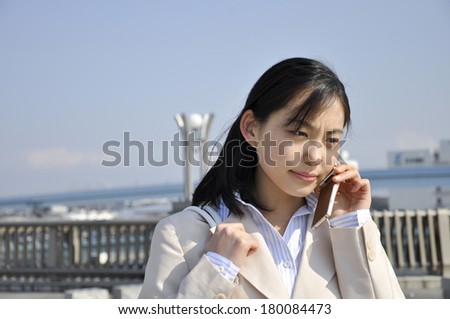 Japanese businesswoman speaking on mobile phone