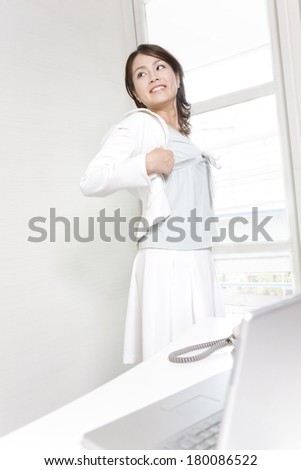 Japanese woman wearing a white jacket