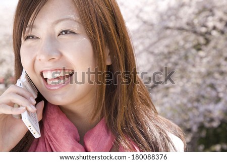 woman to call back in the background of cherry tree