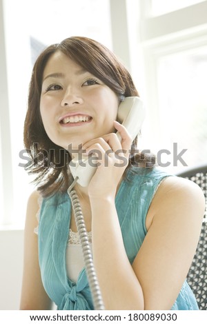 Japanese woman answering the phone