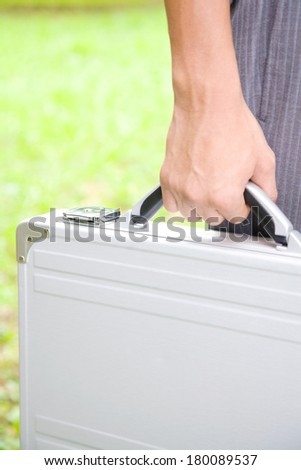 Hand of business Japanese man with attache case
