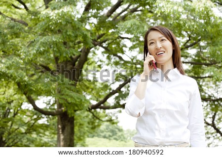 office lady on the phone in the park