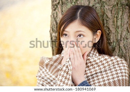 Japanese woman who warm the hands on the breath