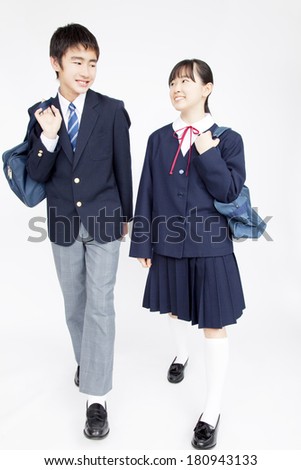 Junior high Japanese men and women walking together