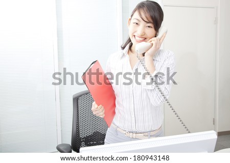 Japanese Office lady speaking on the phone