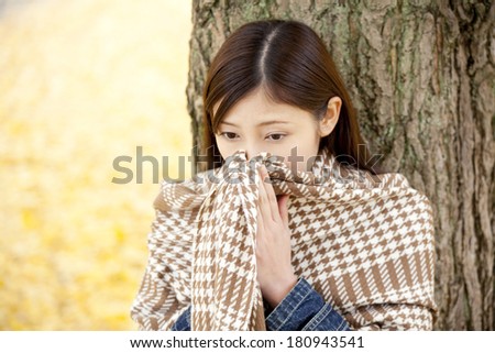 Japanese woman who warm the hands on the breath
