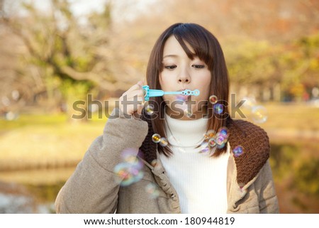 woman playing with marbles,