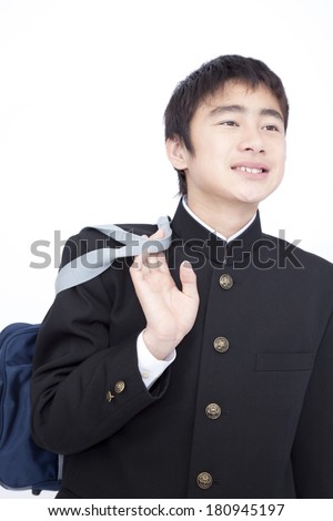 Junior high-Japanese boy smiling with a bag