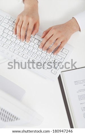 An office lady working on the computer,