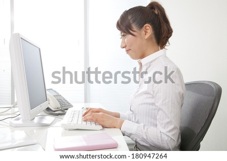 Japanese office lady working on the computer,