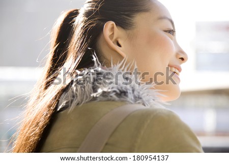 Japanese woman waiting for a bus