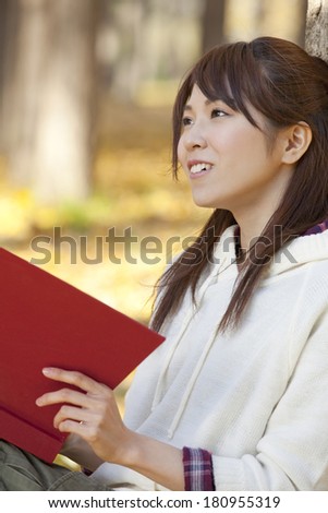 A female Japanese student reading,