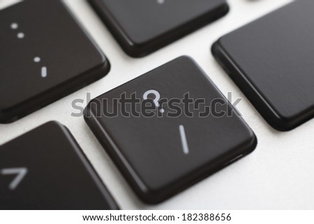 Close-up of question mark key on keyboard