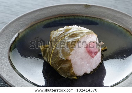 Bean paste rice cake wrapped in a cherry leaf