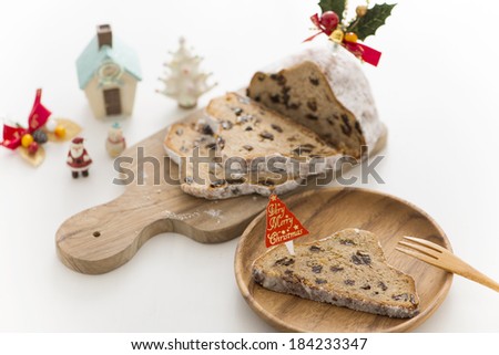 Sliced stollen (German fruit and marzipan Christmas bread) with sign saying \
