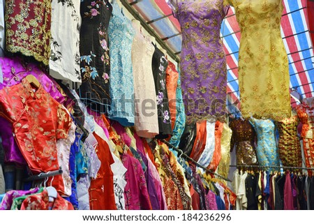 Chinese-style ladies\' dresses in a shop in Hong Kong.