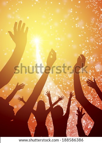 Hands in the air with yellow and orange light