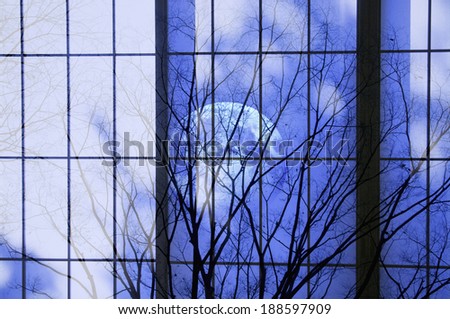 Full moon reflection on building