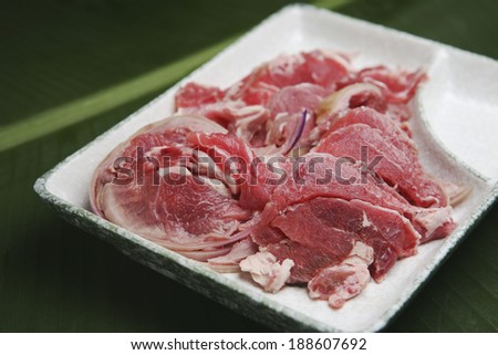 Dish of raw goat meat