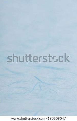 Close-up full-frame image of light blue Japanese paper