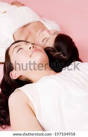 Two Women That Has Been Lying On His Back