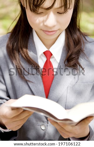 High School Girl Reading A Book