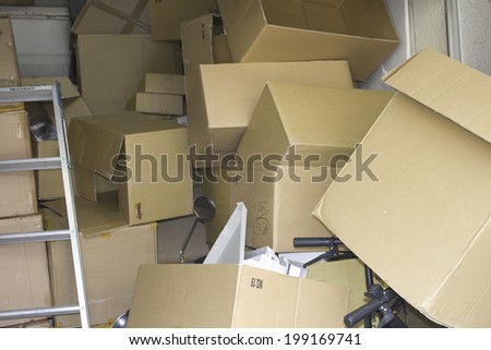 Empty Cardboard Box Stacked In Warehouse