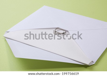 Ring And The Letter In A White Envelope