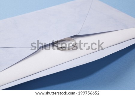 Ring And The Letter In A White Envelope