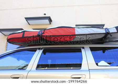 Surfboard On The Roof Of The Car