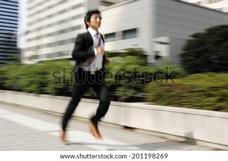 A running businessman