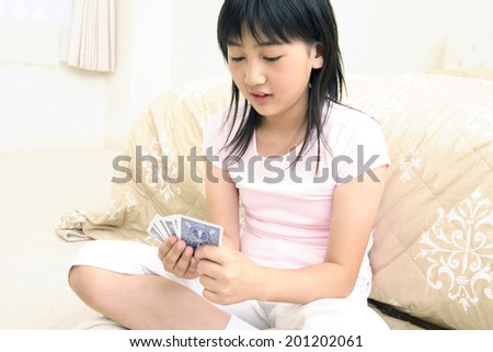 Girl playing cards