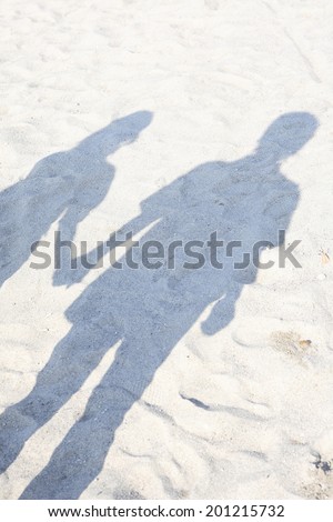 Shadow of a couple holding hands