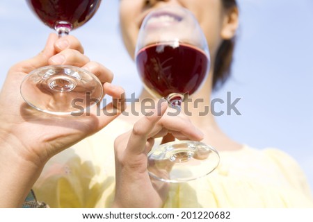 Hand of the woman with wine