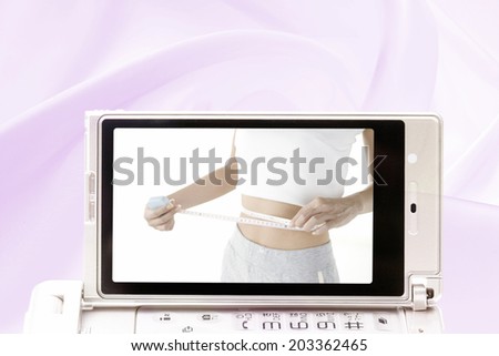 Waist Of A Woman Captured In A Mobile Screen