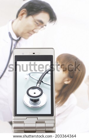 Stethoscope,Doctor And The Patient In The Mobile Screen