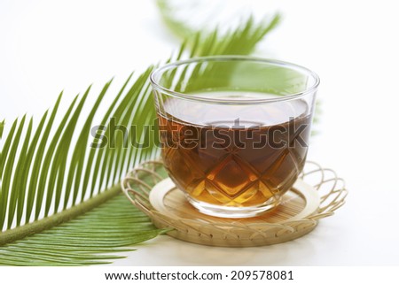 The Barley Tea Made Up Of Glass And The Sprout Of Cycad